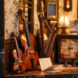 Close-up of the cello and violin inside The Music Room kit