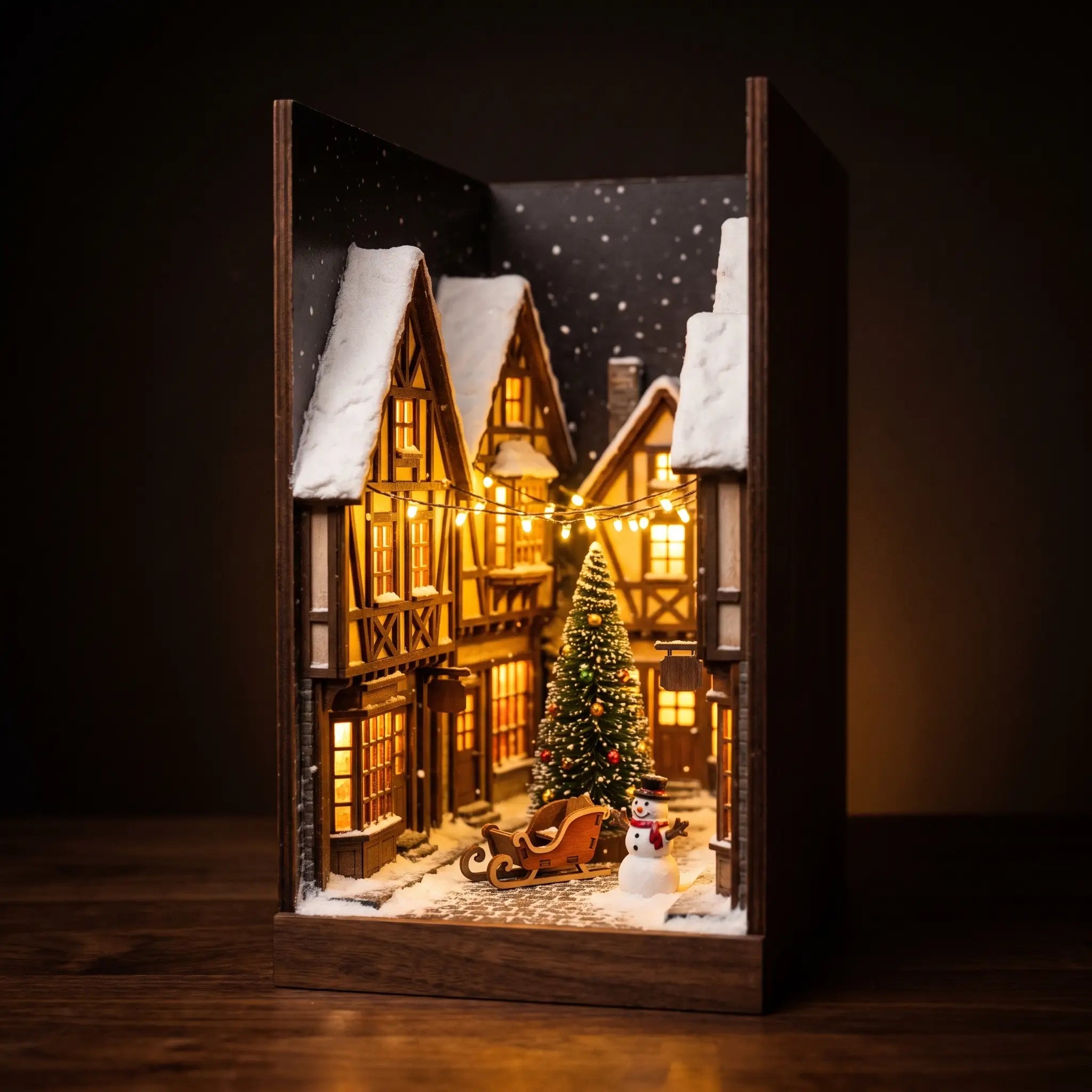 The Winter Lane miniature Christmas village book nook on a dark walnut backdrop