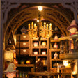 Detail of a hanging candle chandelier inside the alchemy academy book nook