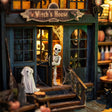 Close-up of the skeleton and ghost on the porch of The Haunted Manor book nook