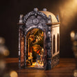 The Dragon's Keep gothic castle book nook on dark walnut with warm amber glow
