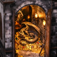 Macro close-up of the dragon over its glowing treasure hoard inside The Dragon's Keep