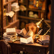 Close-up of the cluttered detective's desk with magnifying glass and pipe