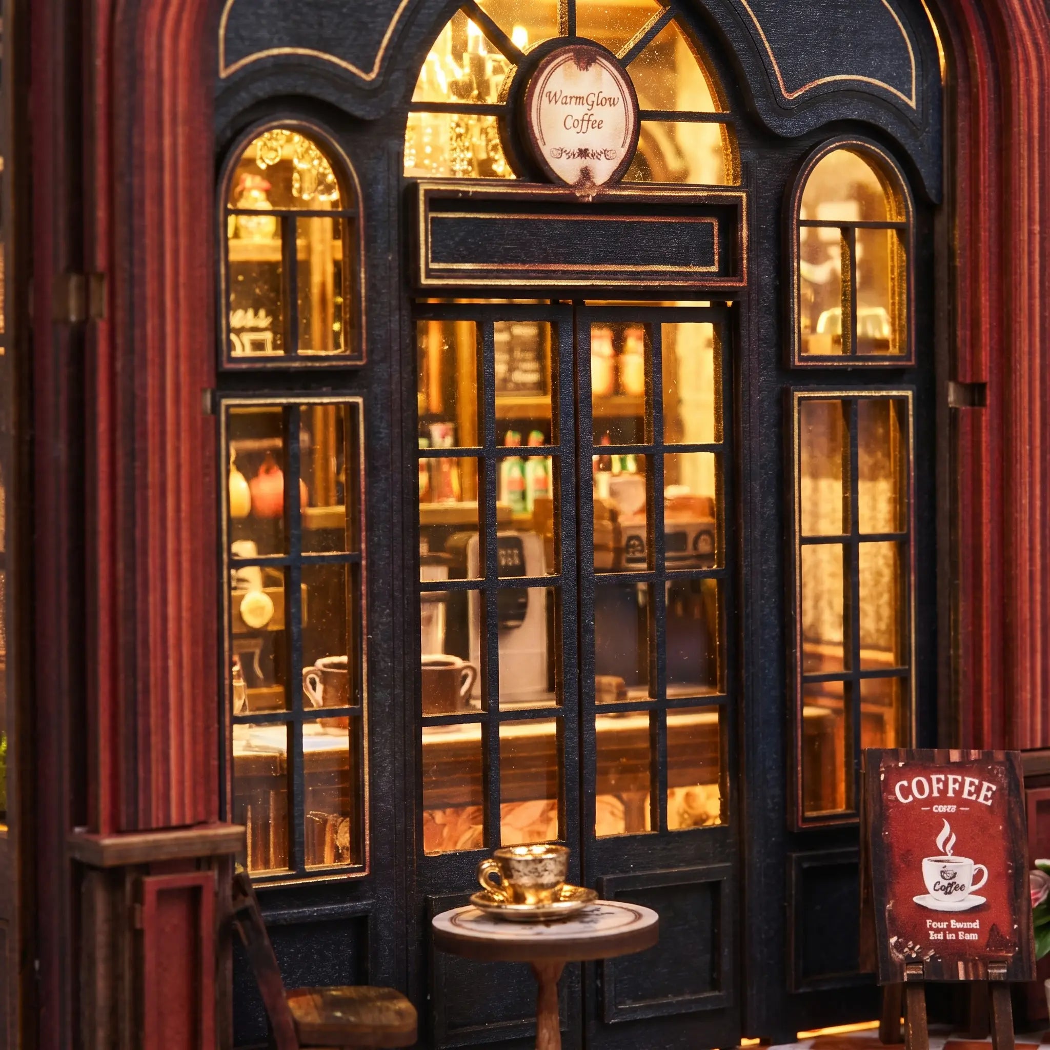 Close-up of the storefront window and arched facade of The Coffee Corner with cafe table