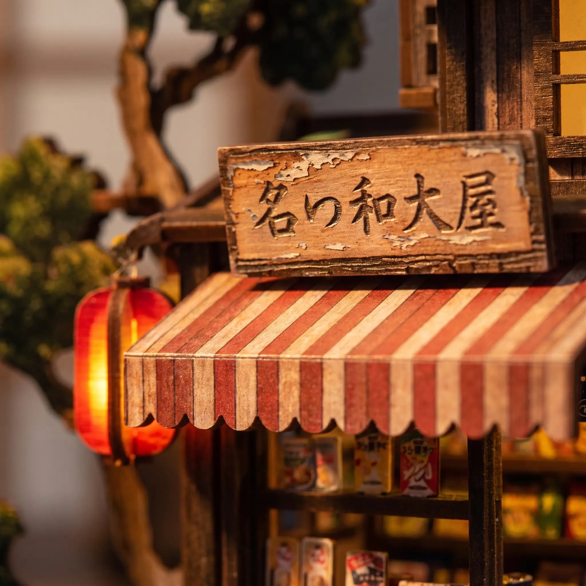 Close-up of The Corner Store striped awning and Japanese shop sign