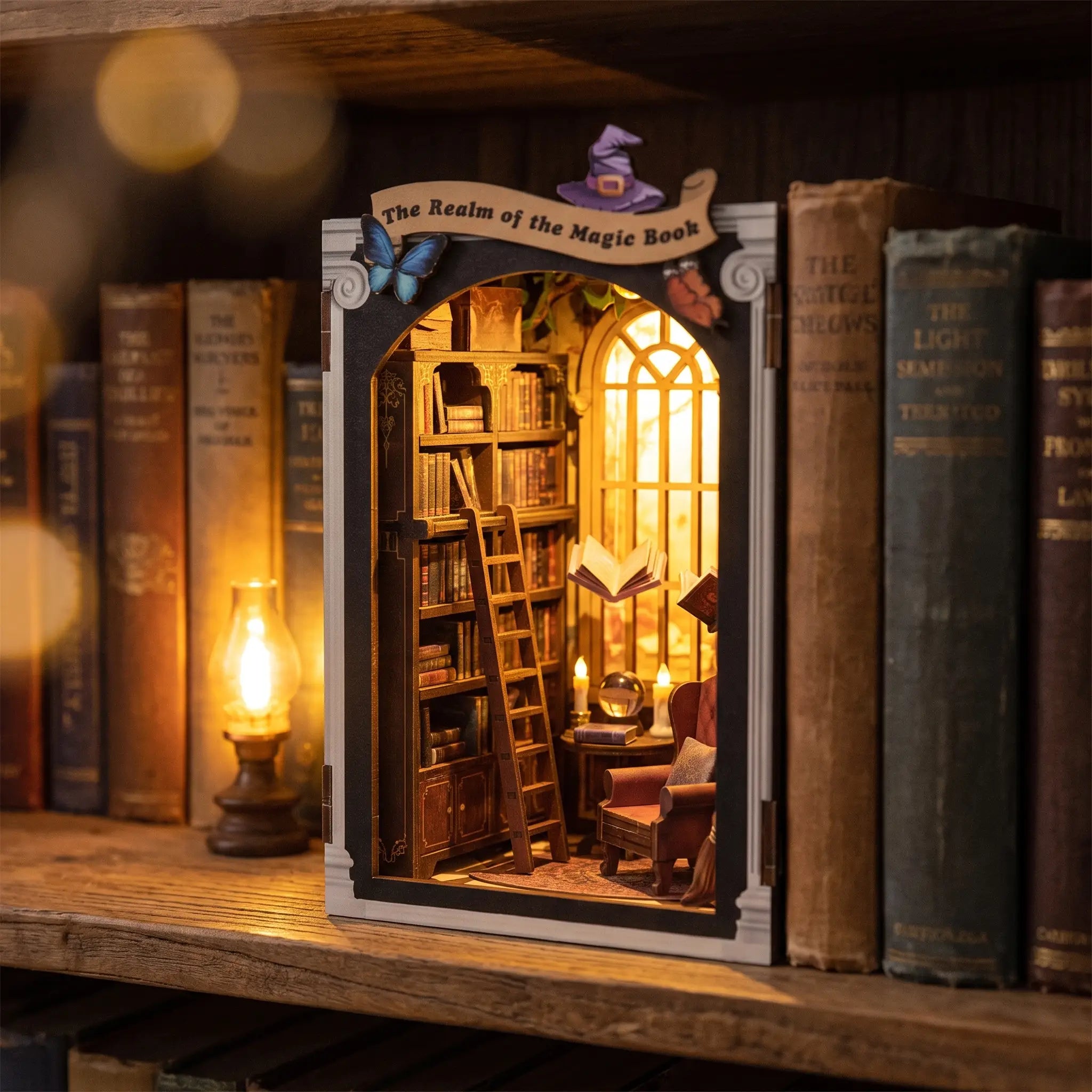 The Spellbound Library slotted on a bookshelf between books at dusk