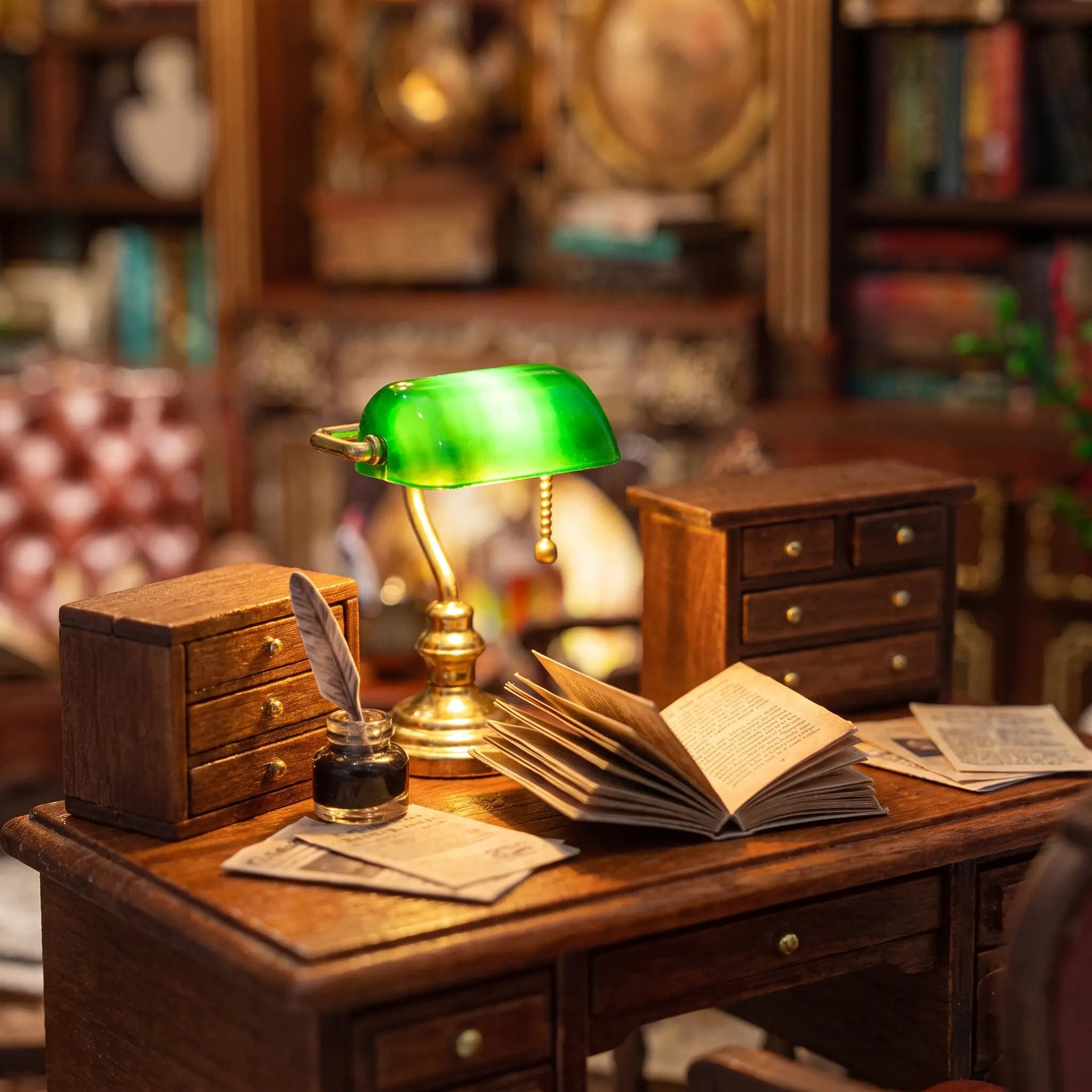 Close-up of the brass banker's lamp on the writing desk inside The Left Bank Study