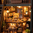 Macro close-up of the lit interior of The Teddy Bear Shop with a bear shopkeeper and shelves