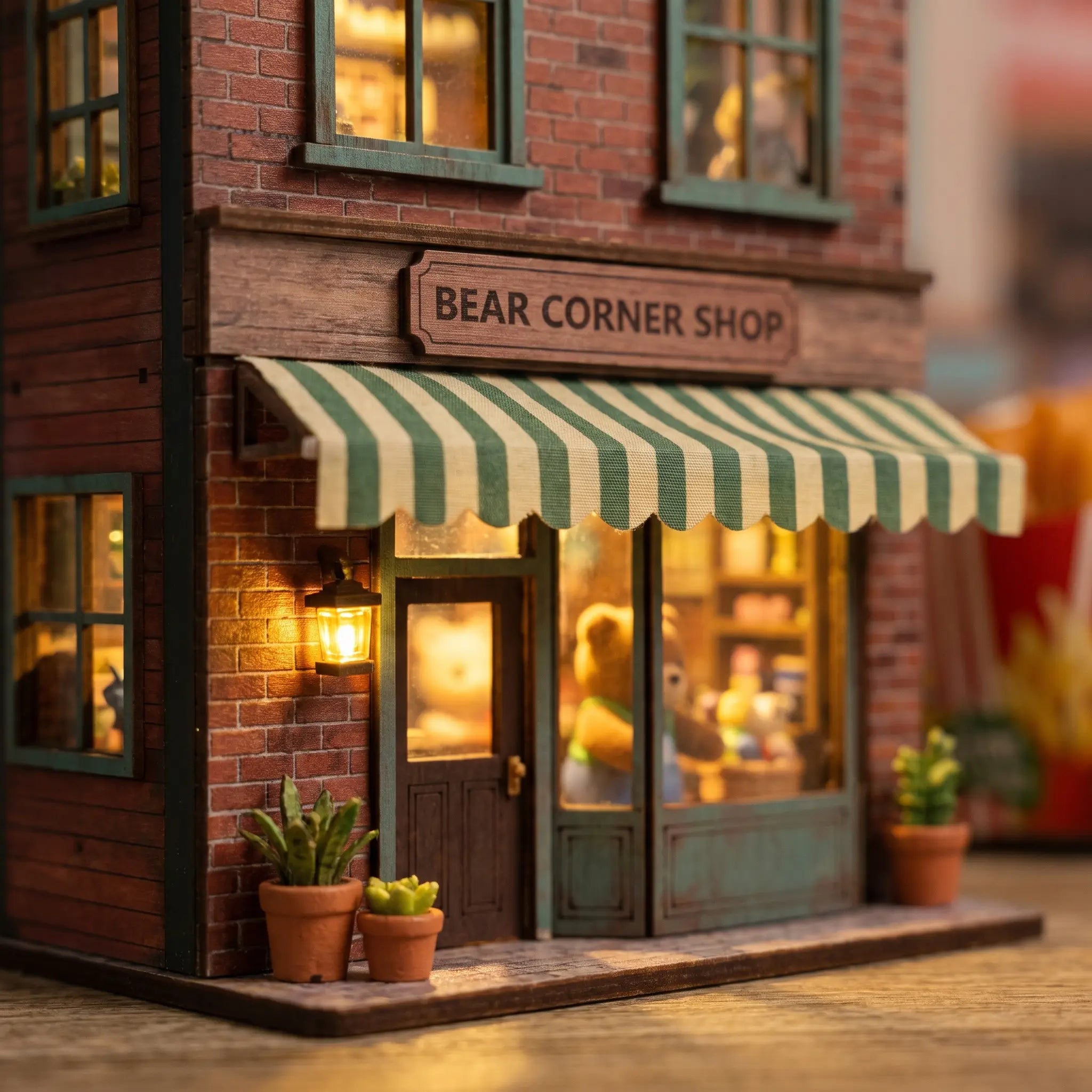 Close-up of the striped awning and brick storefront of The Teddy Bear Shop