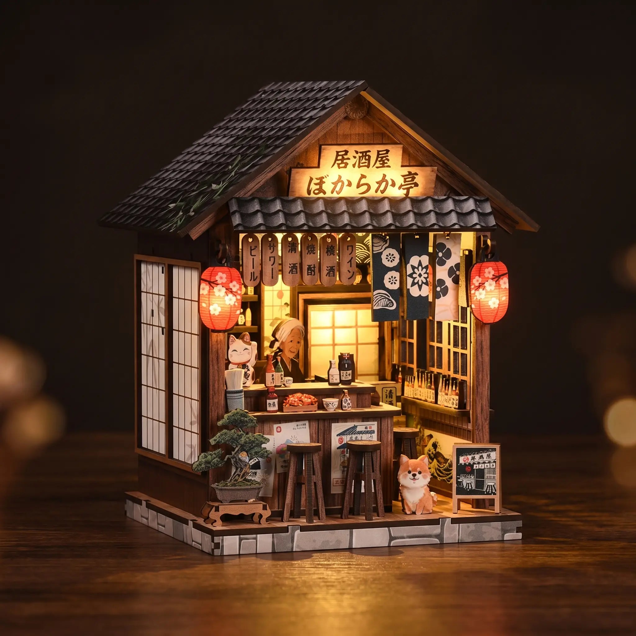 The Izakaya miniature pub on a dark walnut backdrop, warm glow