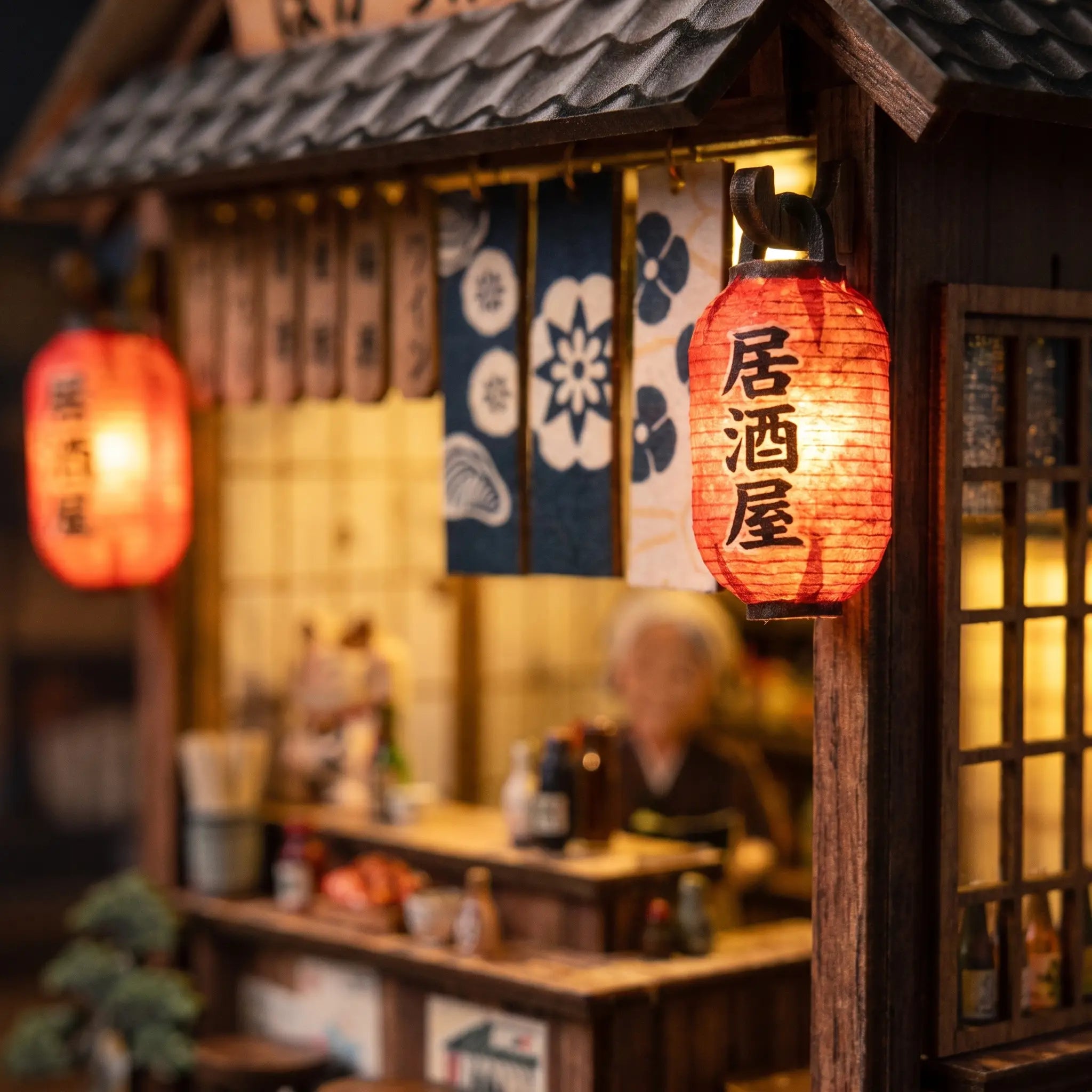 Close-up of the glowing red paper lanterns of The Izakaya