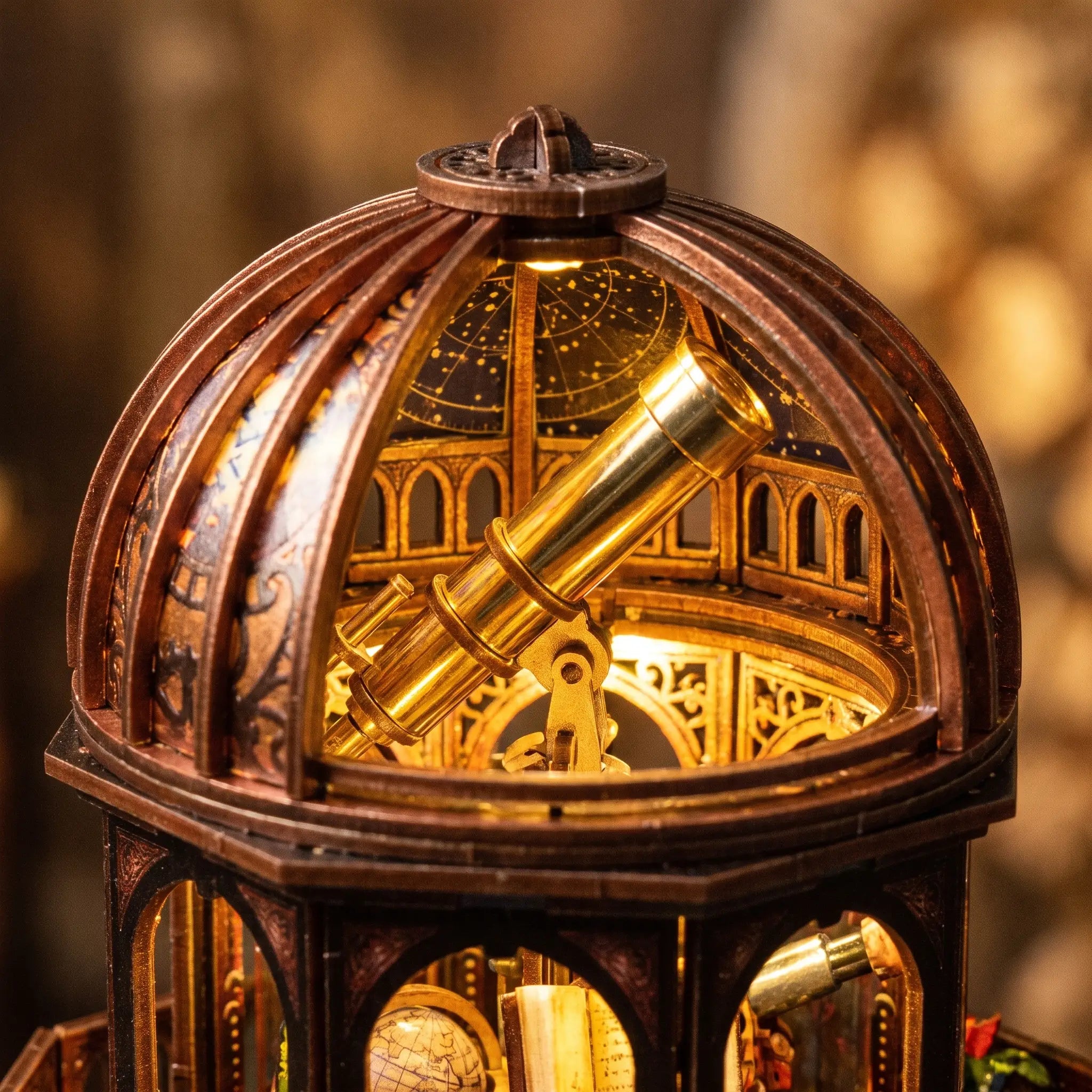 Close-up of the open dome and brass telescope inside The Observatory
