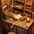 Close-up of the wooden sales counter inside The Wand Shop with a lit lantern