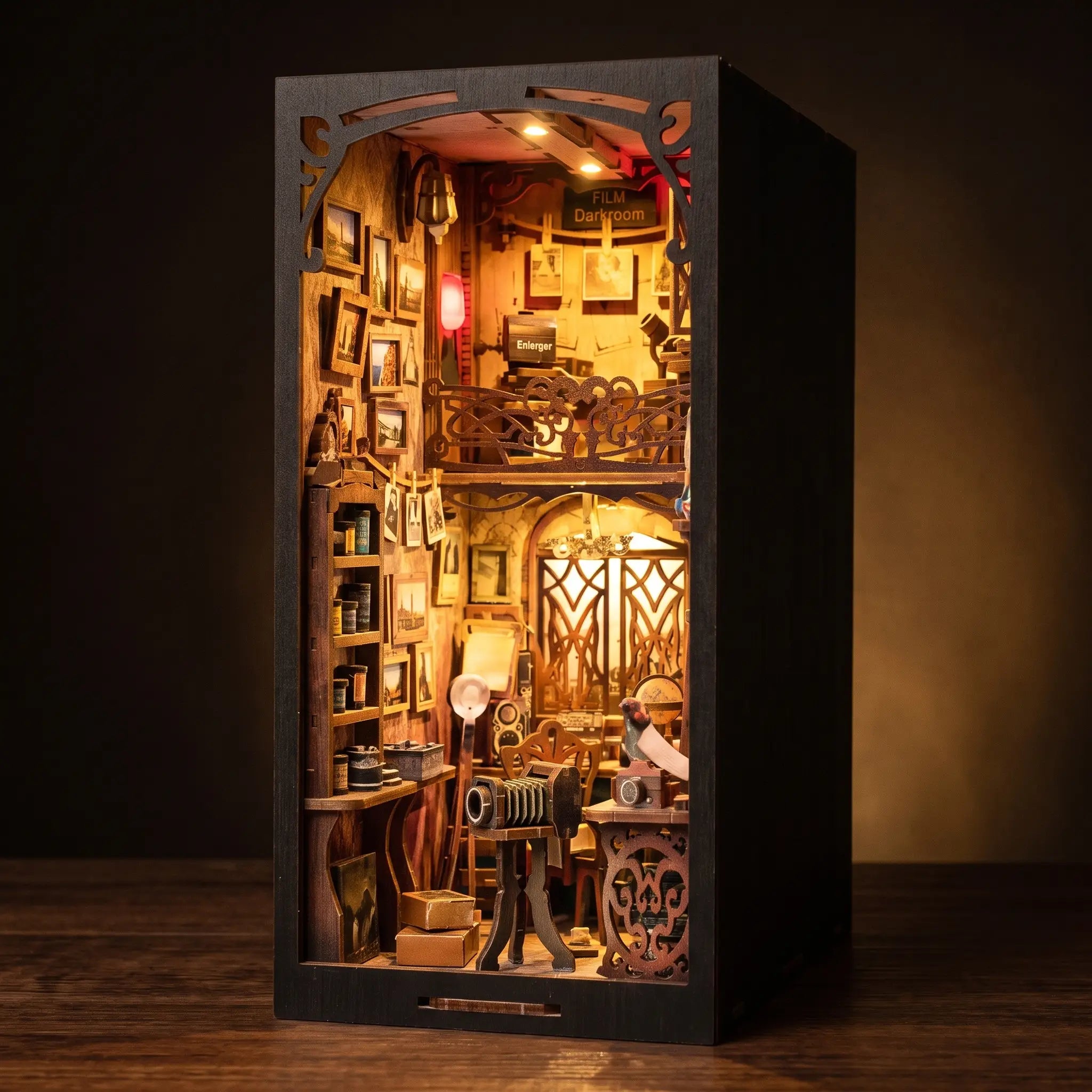The Darkroom book nook lit on a dark walnut backdrop