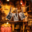 Close-up of tiny prints hanging to dry inside The Darkroom book nook