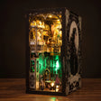 The Clockwork Apothecary book nook glowing emerald and amber on a dark walnut surface