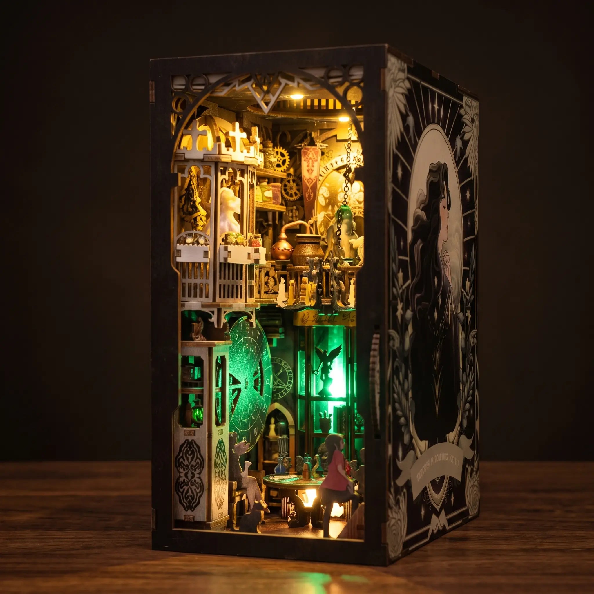 The Clockwork Apothecary book nook glowing emerald and amber on a dark walnut surface