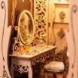 Detail of the vanity table and round mirror in the dressing room