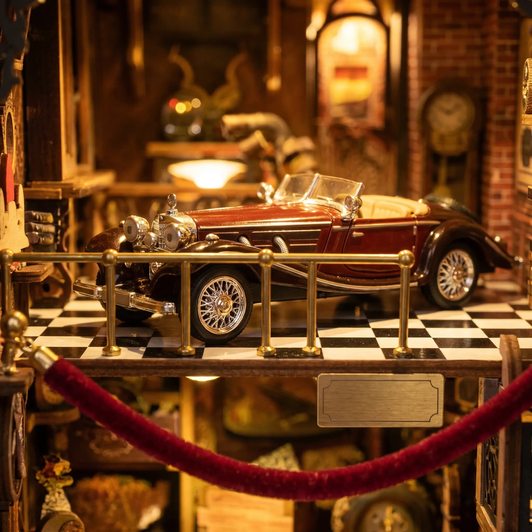 Close-up of a second antique roadster on display behind a brass railing in The Classic Garage
