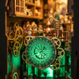 Close-up of the emerald astrological clockwork dial and brass gears inside the apothecary