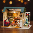 The Christmas Parlour on a dark backdrop, warm holiday glow