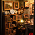 Shelves of tiny books, framed paintings and a glowing reading lamp inside The Fireside Parlour