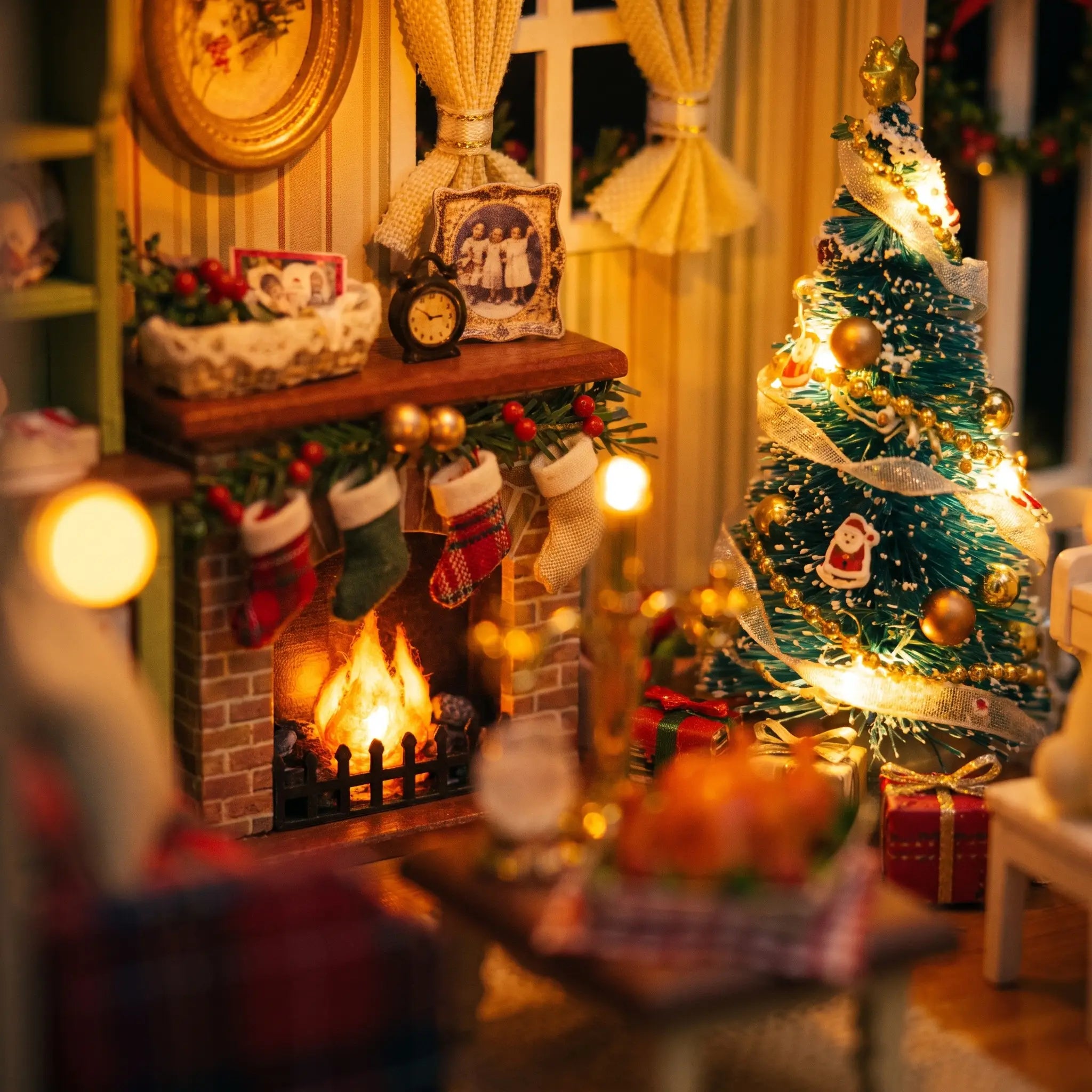 Close-up of the glowing fireplace and lit Christmas tree inside The Christmas Parlour