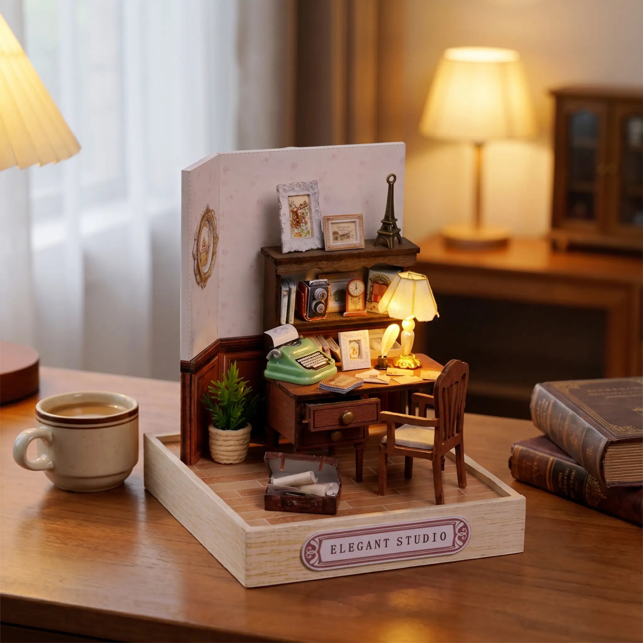 The Writer's Room miniature styled on a wooden desk with a mug and books