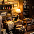 Macro detail of the lit sewing machine and thread inside The Dressmaker's Shop