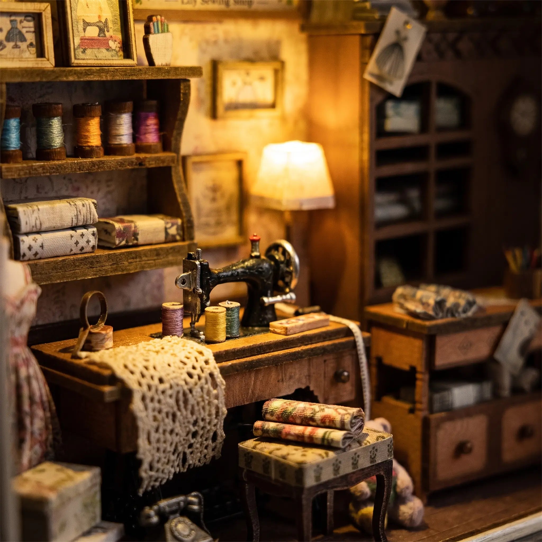 Macro detail of the lit sewing machine and thread inside The Dressmaker's Shop
