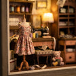 Close-up of the dress-form mannequin in a floral dress inside The Dressmaker's Shop