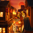 Close-up of red paper lanterns strung overhead in The Lantern Alley book nook