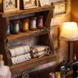 Close-up of the thread and fabric shelf inside The Dressmaker's Shop