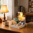 The Potting Shed displayed on a cozy wood desk