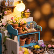 Close-up of the lit potting bench with flowers