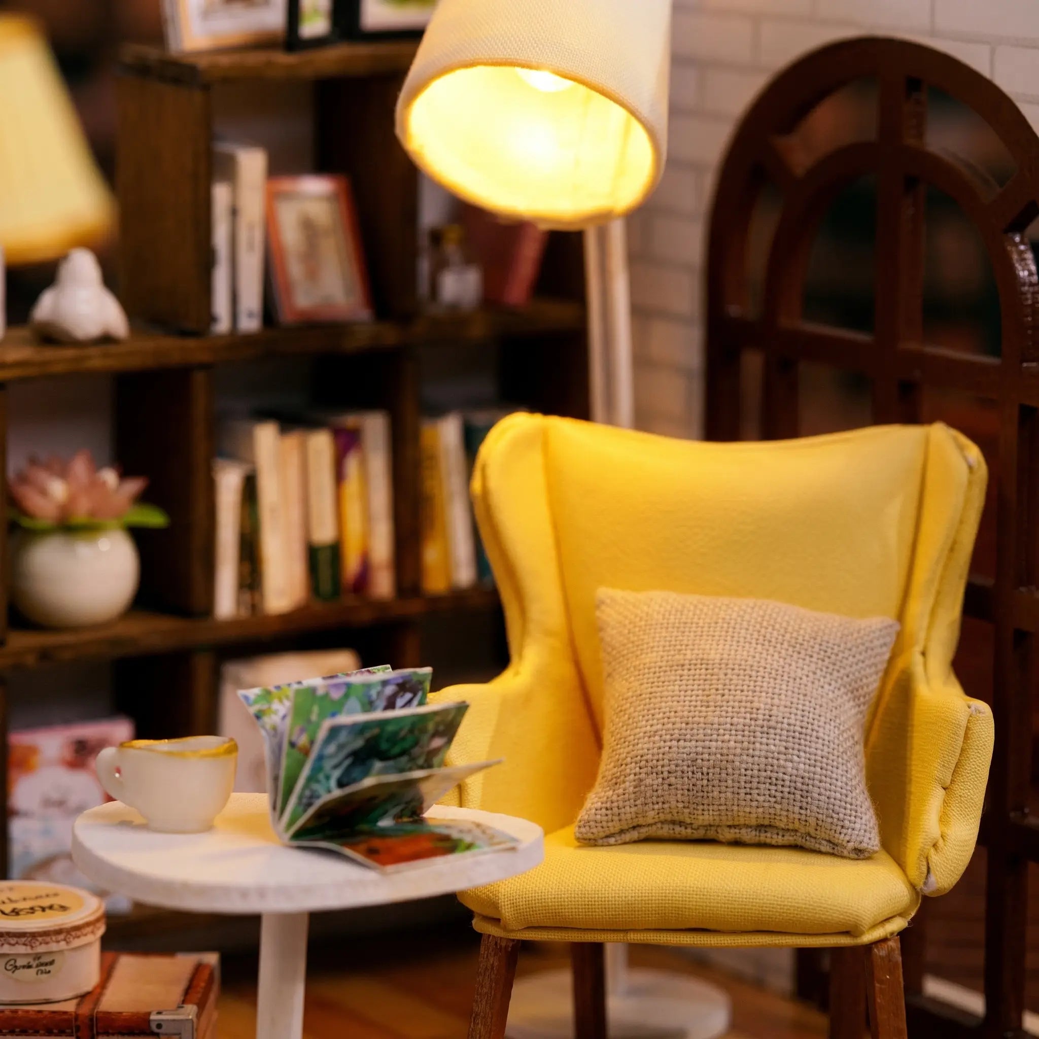 Close-up of the mustard armchair and glowing floor lamp in The Quiet Corner
