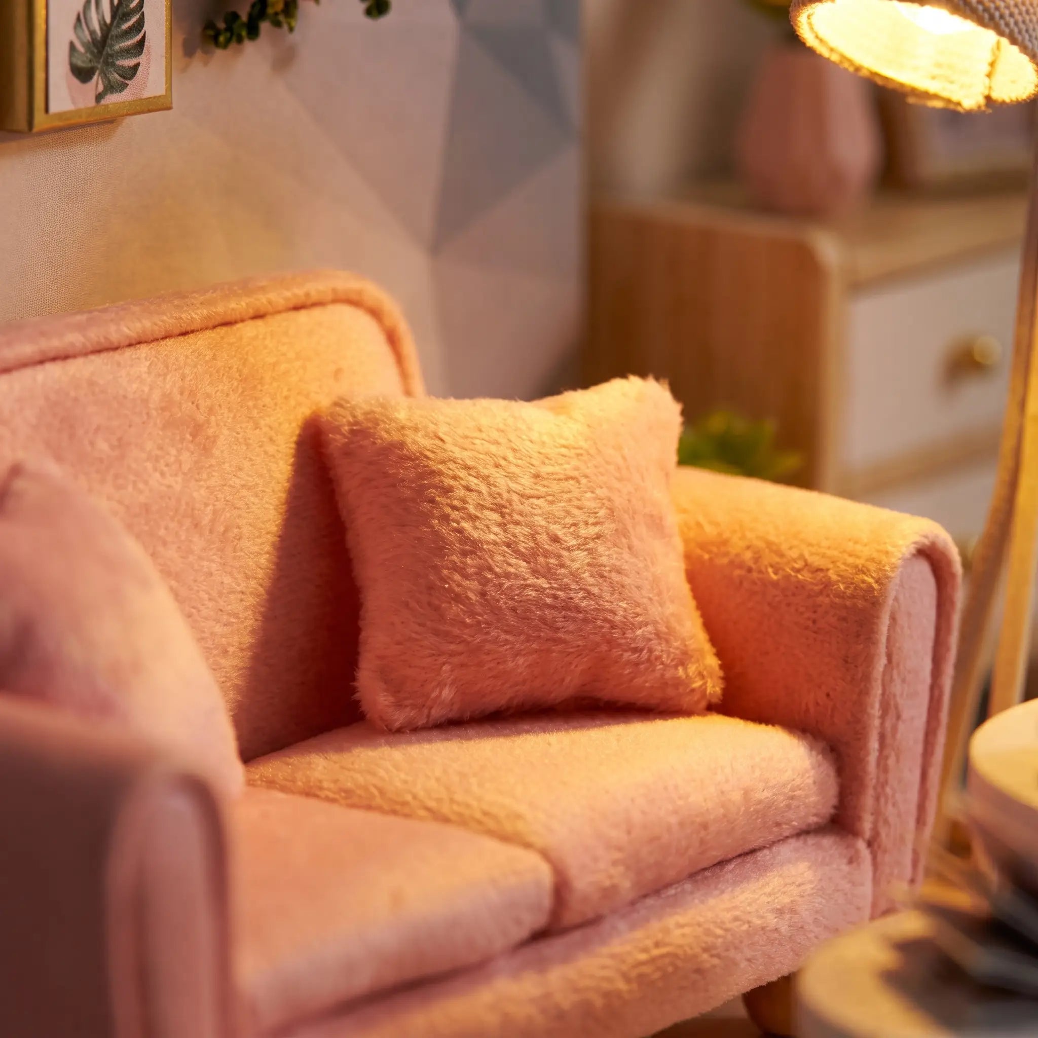 Close-up of the pink velvet loveseat and cushion in The Sunday Lounge