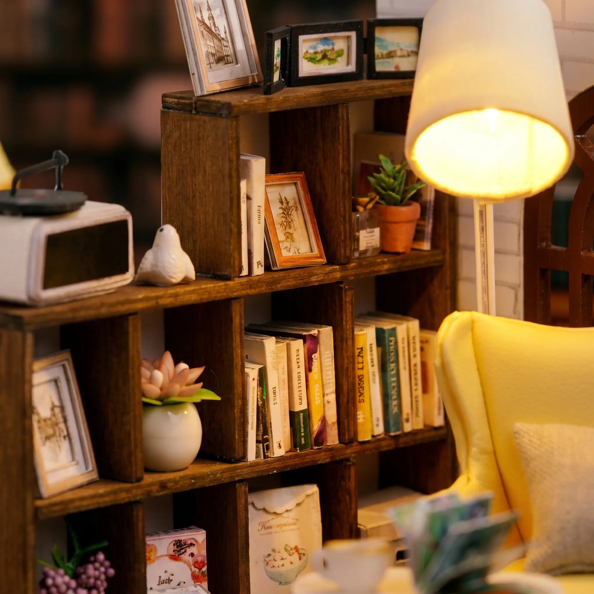 Close-up of the bookshelf full of tiny books and plants in The Quiet Corner