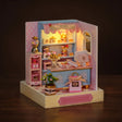 The Gumball Shop lit on a dark walnut backdrop