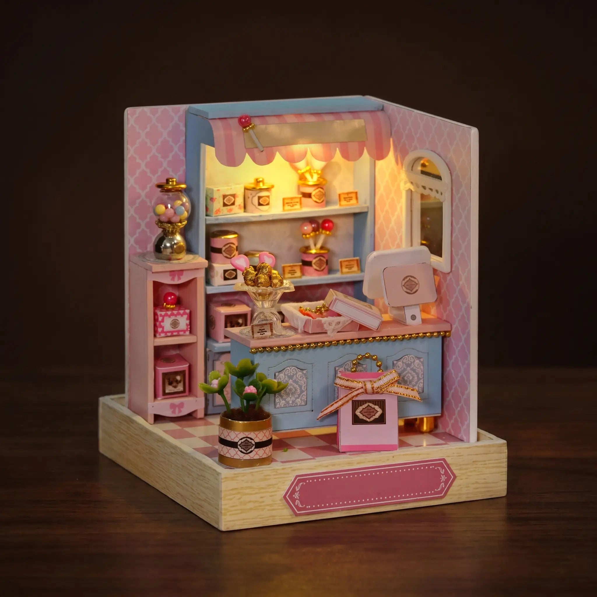 The Gumball Shop lit on a dark walnut backdrop