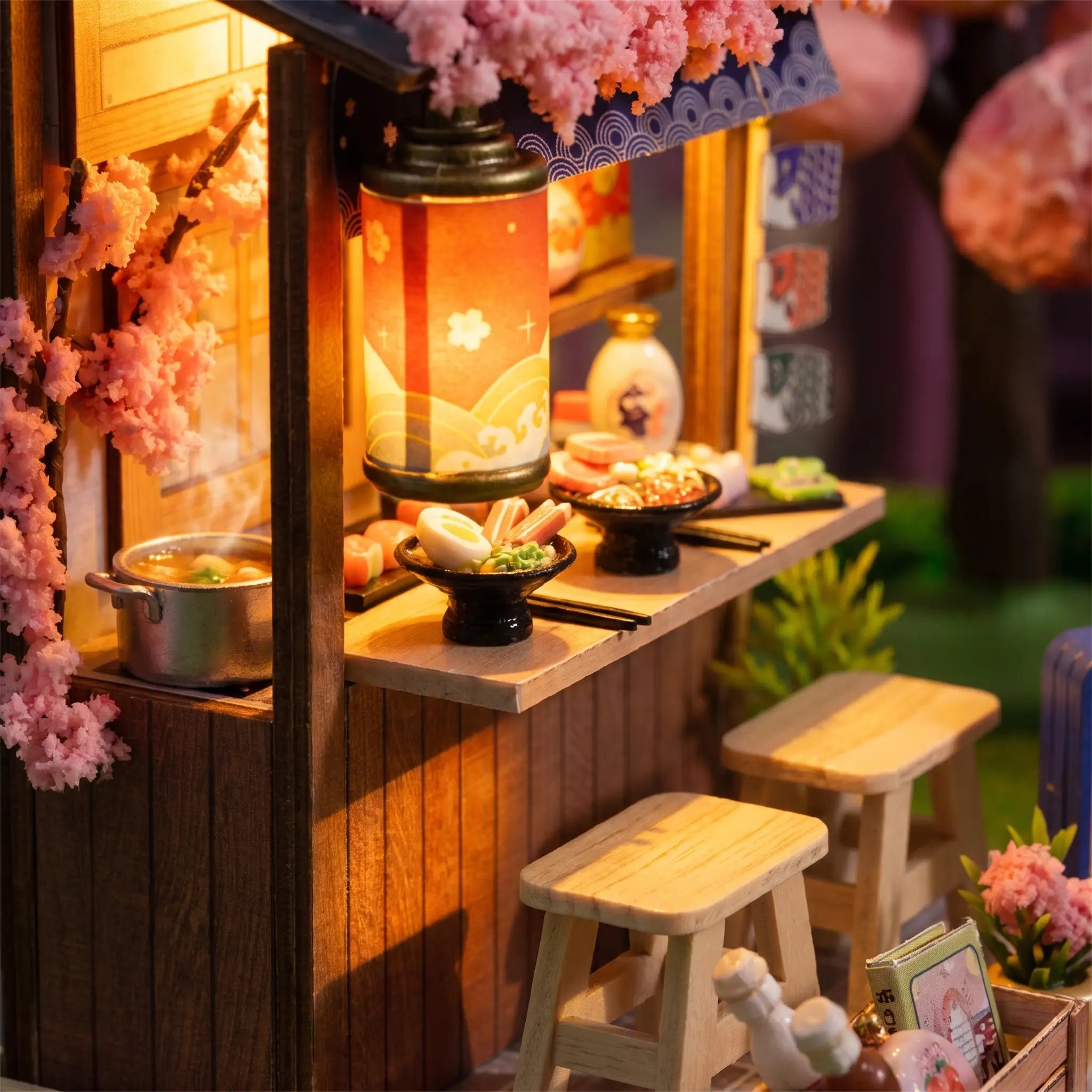 Macro detail of the glowing paper lantern over the ramen counter