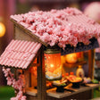 Close-up of the cherry-blossom-pink tiled roof and lantern