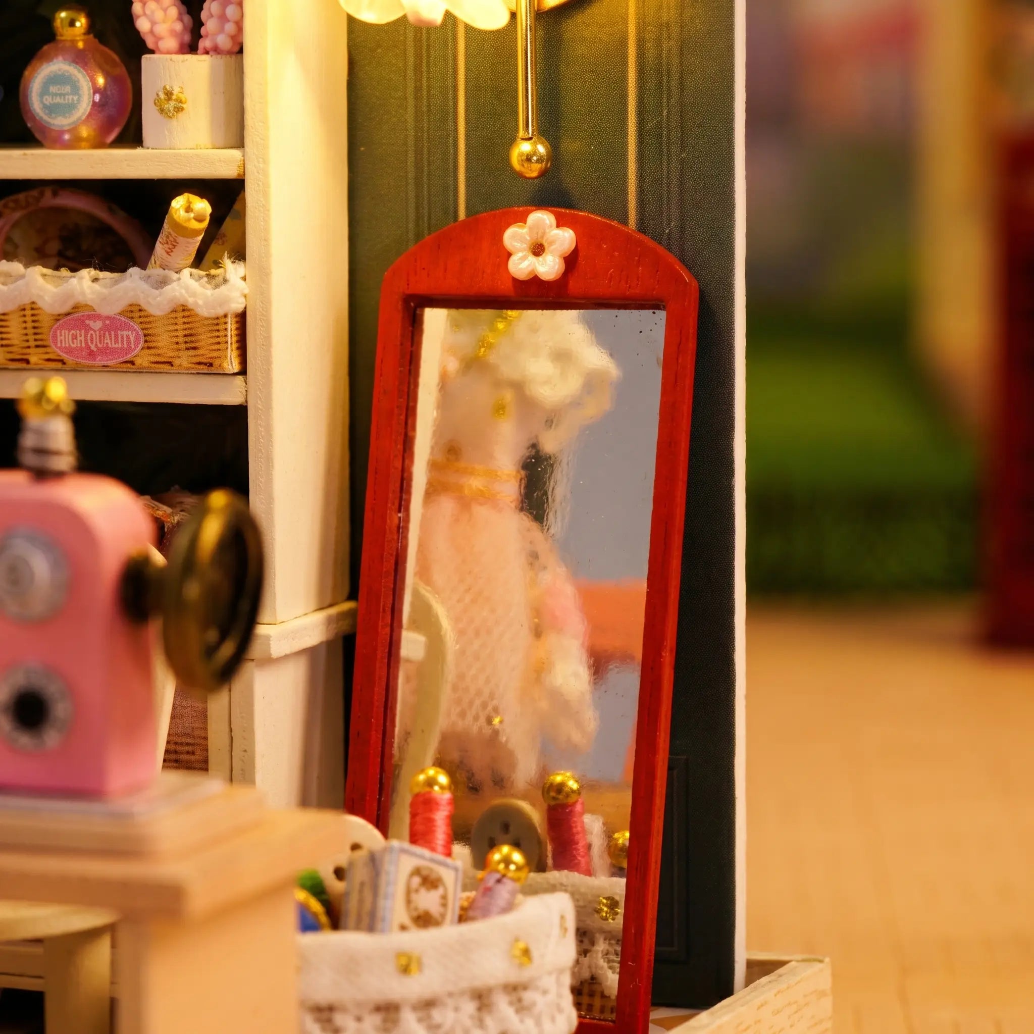Close-up of the red-framed full-length mirror in The Sewing Corner