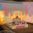 Close-up of the candy shop striped awning and sign banner