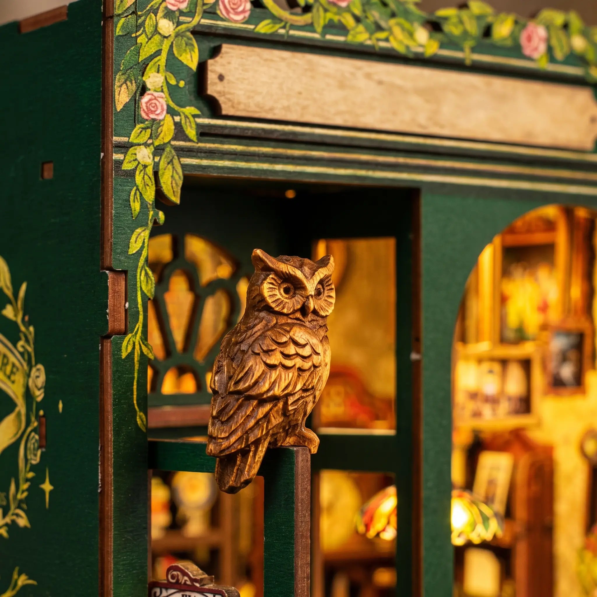 Close-up of the carved owl perched on the corner of The Owl Bookshop