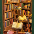 Close-up of the packed bookshelves and violin inside The Owl Bookshop