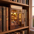 The Record Shop book nook slotted on a bookshelf between books at dusk