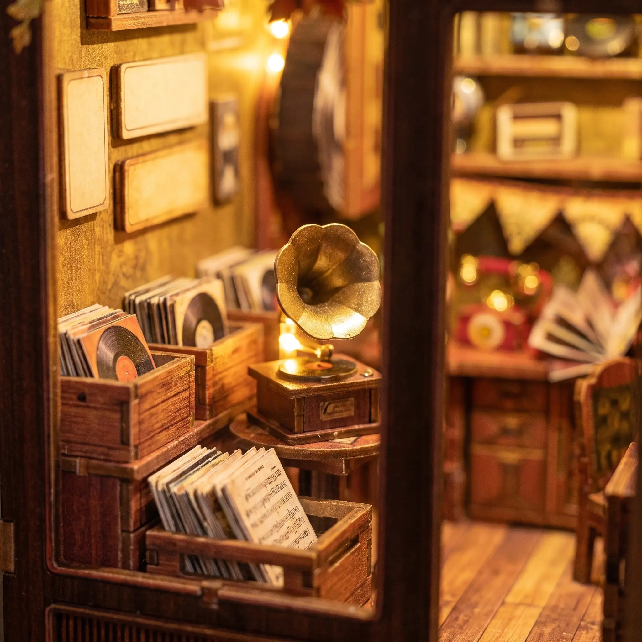 Macro detail of the lit interior of The Record Shop with a gramophone and crates of vinyl records