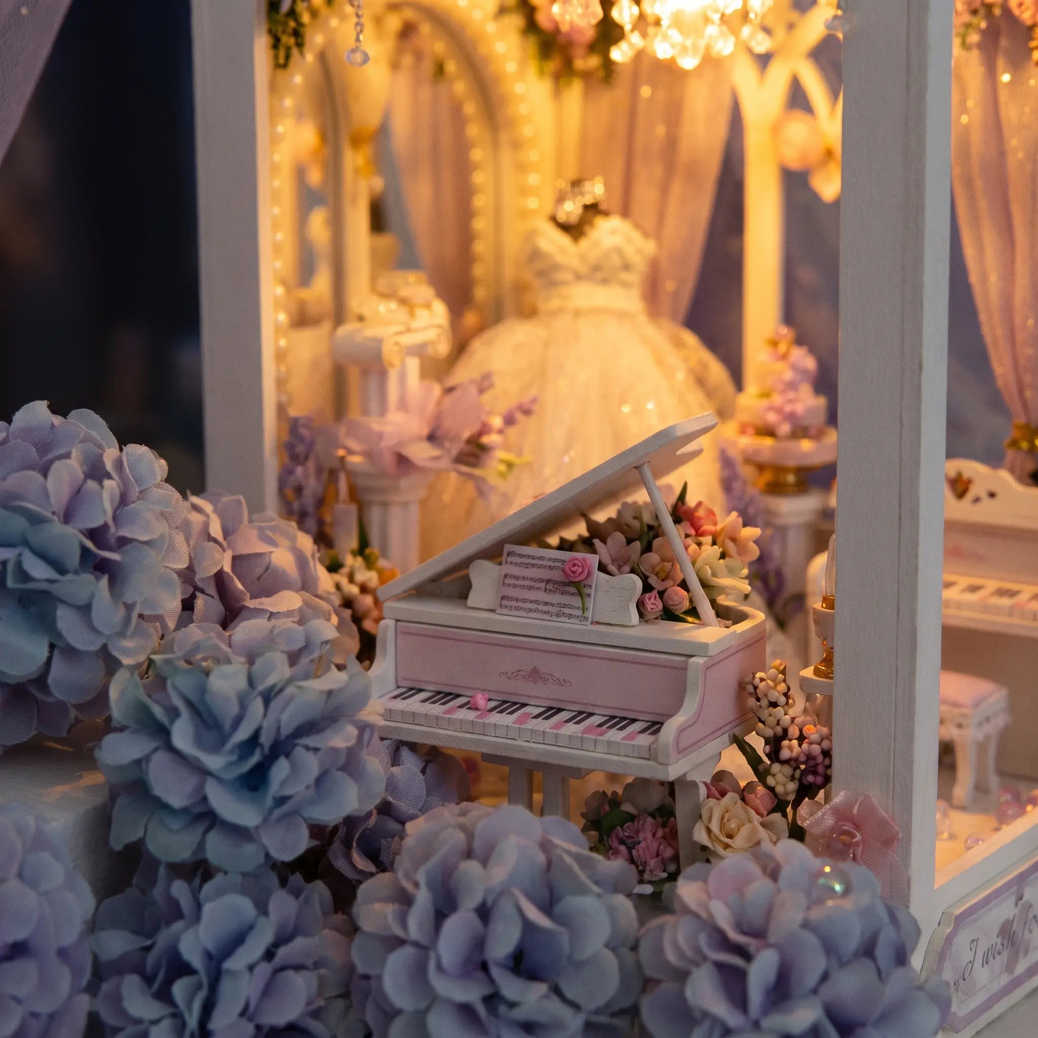 Close-up of the small grand piano and pastel hydrangeas inside the wedding chapel