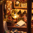 Detail of the brass-horn gramophone on the counter in The Record Shop book nook
